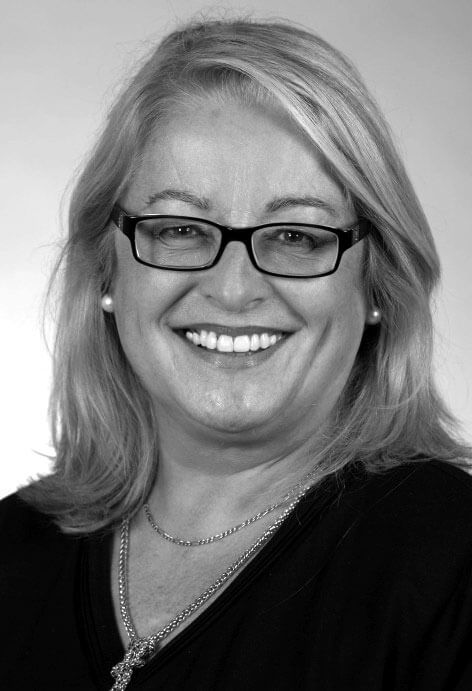 Alicia Carriquiry wearing a necklace, photographed in black and white.