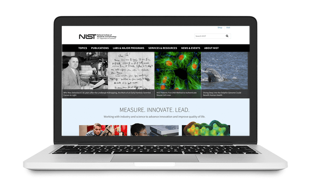 Laptop displaying the NIST website with various science-related images and navigation menus.