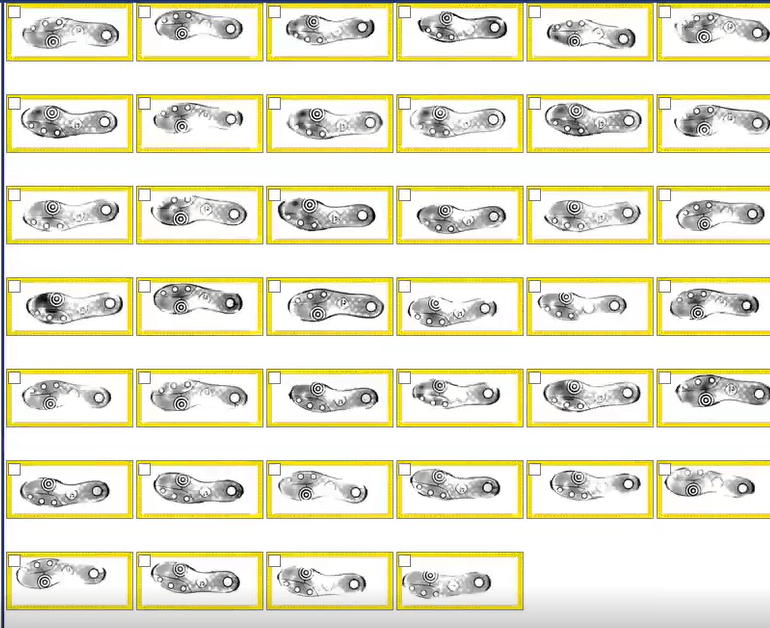 A grid of grayscale mechanical parts, some outlined in yellow rectangles, arranged in five rows.