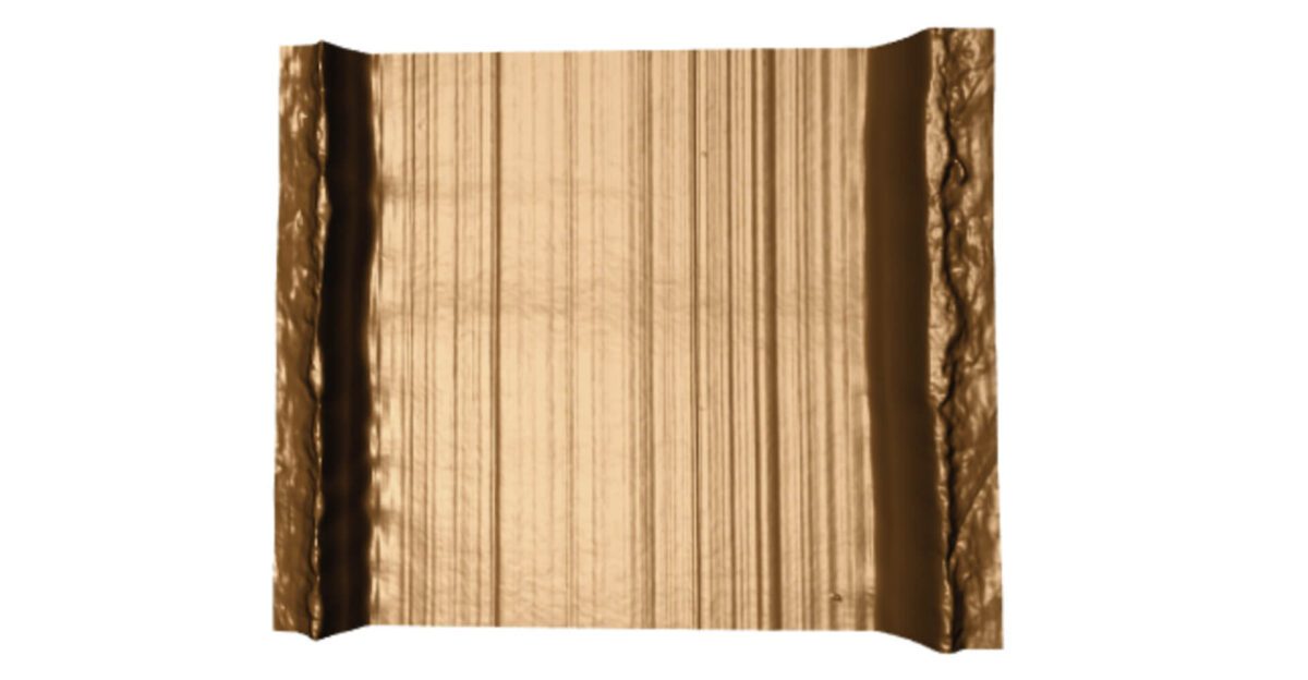 A metallic, rectangular sheet with vertical lines and rough, wavy edges on both sides.
