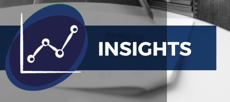 Line graph icon and the word “INSIGHTS” over a blurred grayscale background.